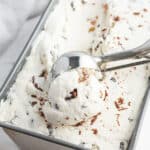 close up no churn rum raisin ice cream in loaf pan with ice cream scoop