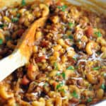 pot of chili mac with wooden spoon