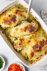 overhead baked salsa verde chicken in white casserole dish