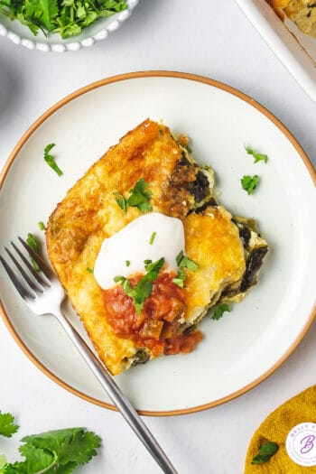 overhead square portion of chile relleno casserole on plate with fork