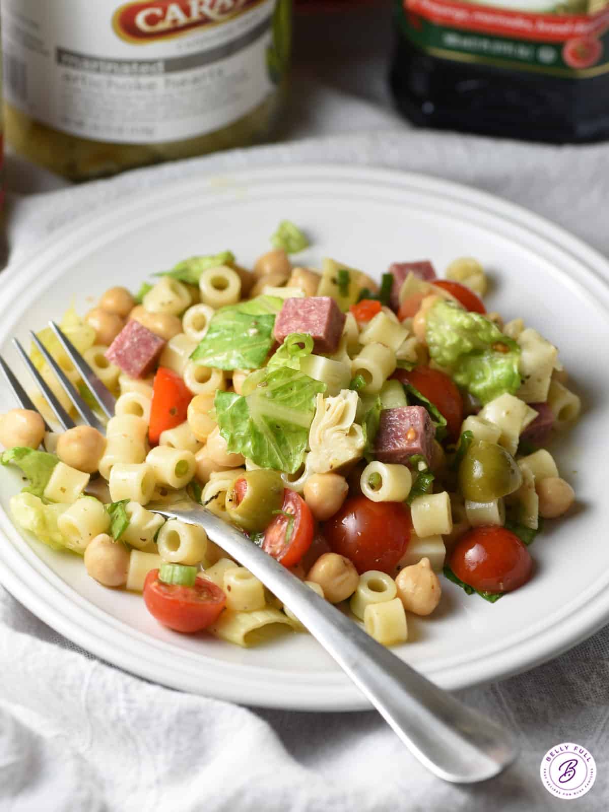 serving of Italian Chopped Salad on white plate with fork