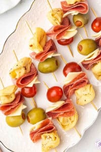 Mini Tortellini Kabobs with salami, cherry tomatoes, and cheese on party skewers